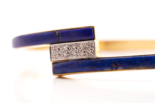 Lot 153 - A lapis lazuli and diamond hinged bangle, half...