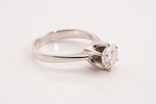 Lot 273 - A diamond solitaire ring, scintillating with a...