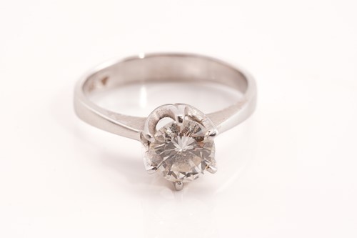 Lot 273 - A diamond solitaire ring, scintillating with a...