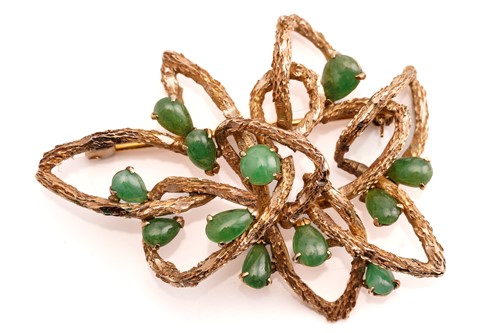 Lot 123 - A modernist brooch set with jade, comprises a...