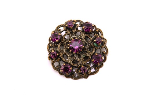 Lot 117 - Five gem-set rings and a brooch; to include a...