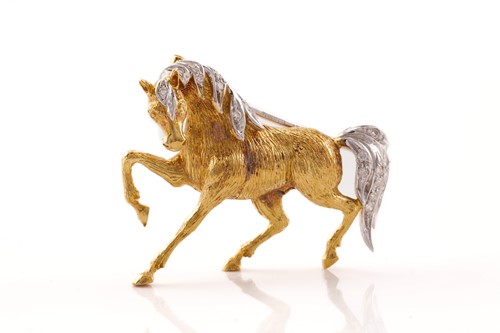 Lot 51 - Mappin & Webb - An 18ct gold horse brooch set...
