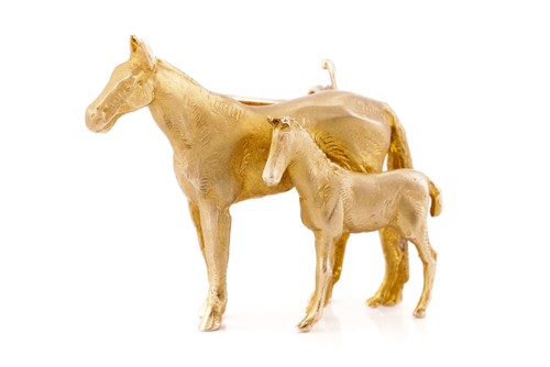 Lot 209 - A mare and foal horse brooch in 9ct yellow...