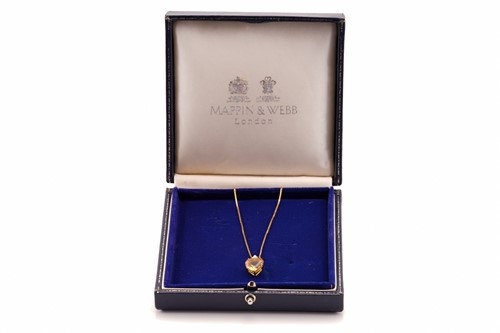 Lot 194 - A topaz and diamond pendant on chain,...