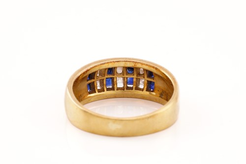 Lot 35 - A diamond and sapphire dress ring of stripe...