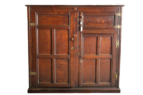 Lot 278 - An 18th oak Wainscott cupboard with a planked...