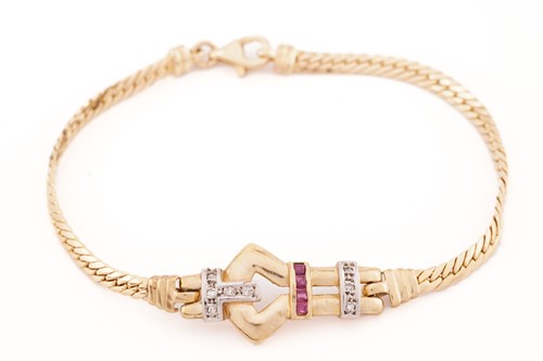Lot 202 - A buckle bracelet set with diamonds and rubies,...