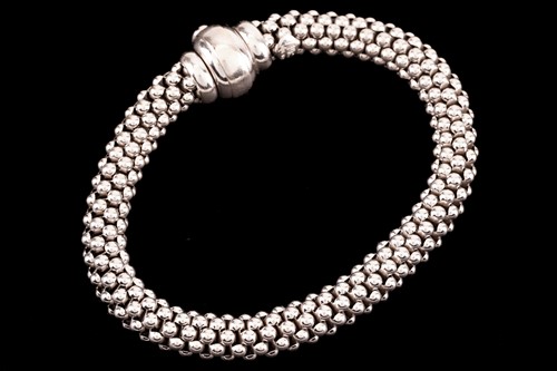 Lot 17 - FOPE - A Flex'It necklace and a bracelet; The...
