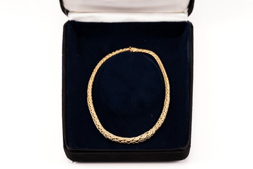 Lot 30 - Tiffany & Co. - A graduated wheat necklace in...