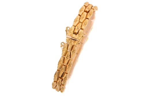 Lot 125 - A three-row brick link bracelet, composed of...