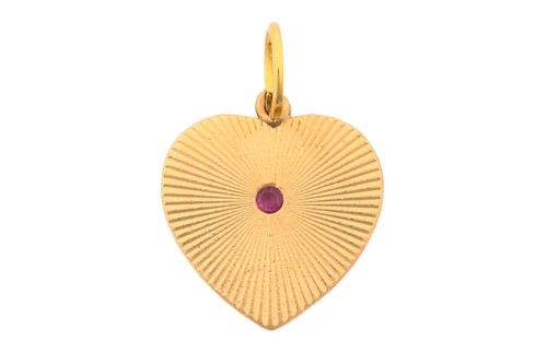 Lot 243 - A heart-shaped pendant, set with ruby in the...