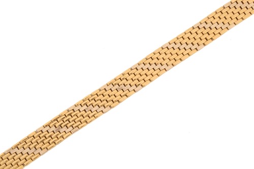 Lot 75 - A seven-row brick link chain in 18ct gold, two-...