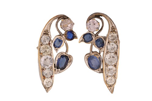 Lot 93 - A pair of peapod earrings set with sapphires,...