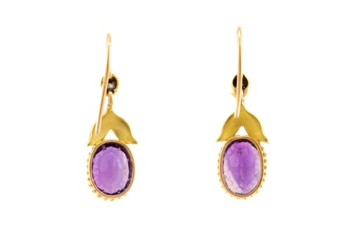 Lot 136 - A pair of amethyst and diamond earrings, each...