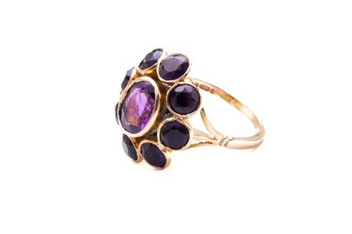 Lot 41 - An amethyst cluster ring in 9ct yellow gold,...