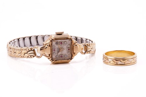 Lot 322 - A vintage Chalet watch and a wedding band, the...