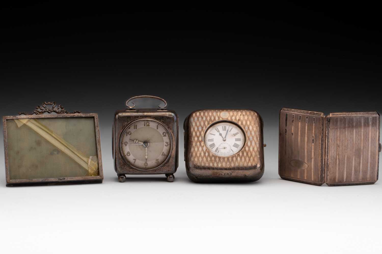 Lot 409 - A silver pocket watch case with easel stand...