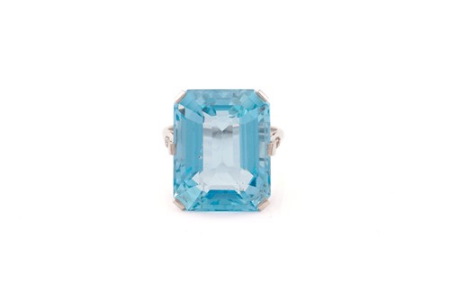 Lot 140 - A large aquamarine dress ring, featuring an...