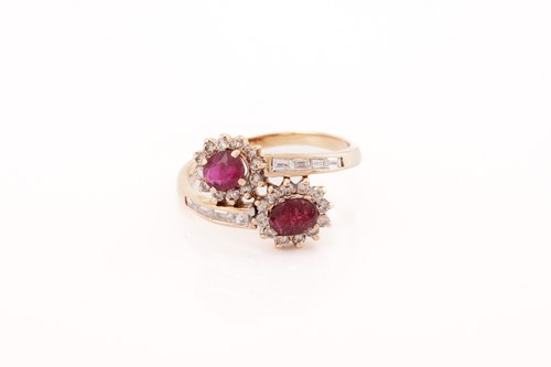 Lot 308 - A ruby and diamond bypass ring, composed of...
