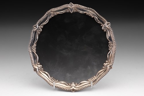 Lot 439 - A George III silver salver with cast beaded...