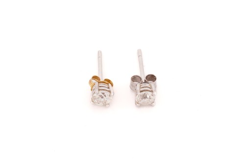 Lot 55 - A pair of diamond stud earrings in 18ct white...