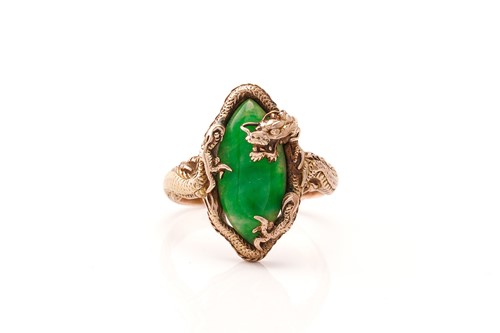 Lot 53 - A Chinese dragon ring set with green jade,...