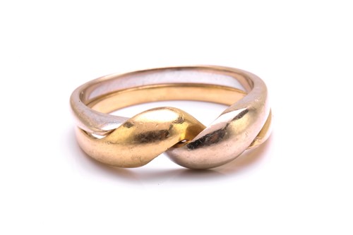 Lot 106 - A two-tone puzzle ring, with two conjoined...