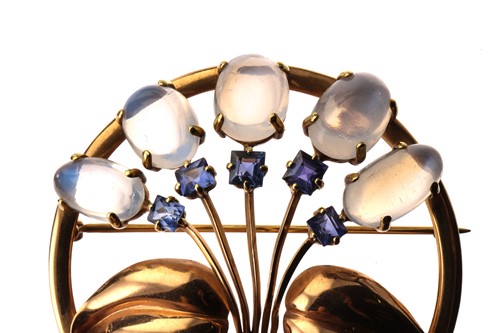 Lot 214 - A floral brooch set with moonstones and...