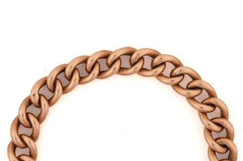 Lot 131 - A 9ct rose gold bracelet with a heart padlock,...