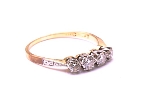 Lot 118 - A four-stone Diamond half hoop ring, featuring...