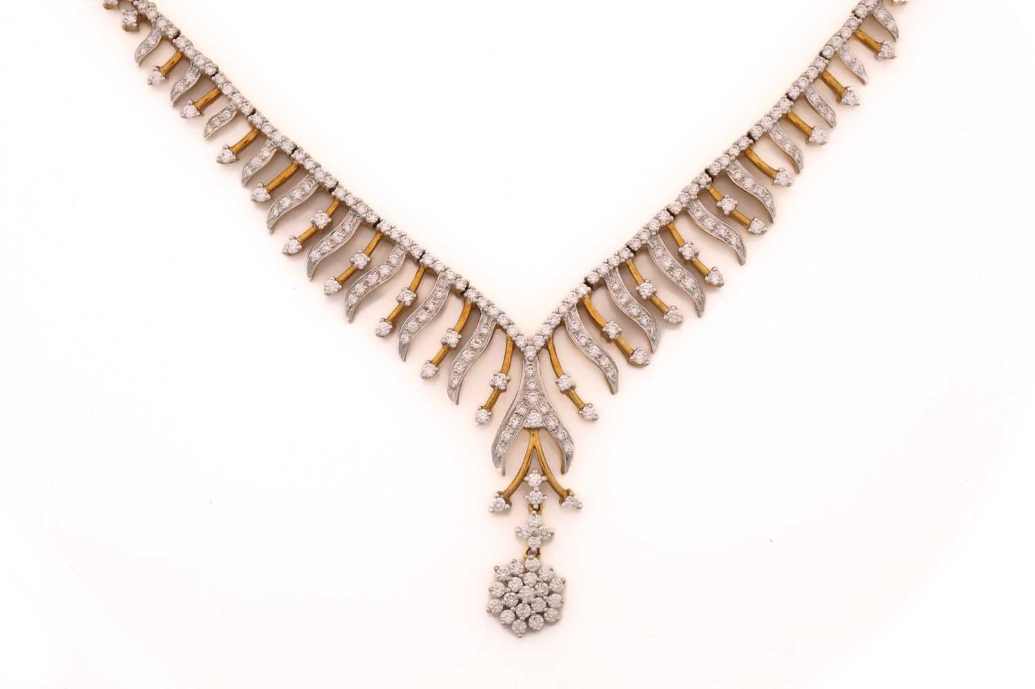 Lot 95 - A diamond V-shaped fringe necklace,...