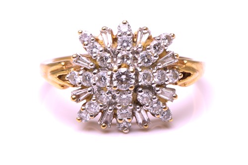Lot 192 - A diamond cluster ring, comprises round...