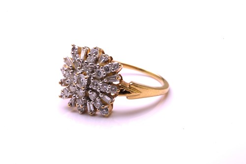Lot 192 - A diamond cluster ring, comprises round...