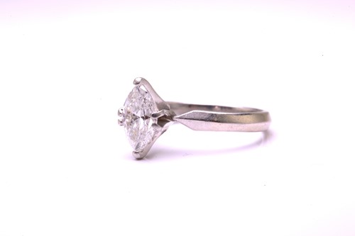 Lot 15 - A marquise diamond solitaire ring, comprises a...