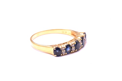 Lot 162 - A sapphire and diamond half hoop ring,...