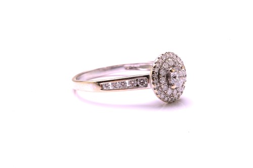 Lot 92 - An 18ct white gold diamond set cluster ring,...