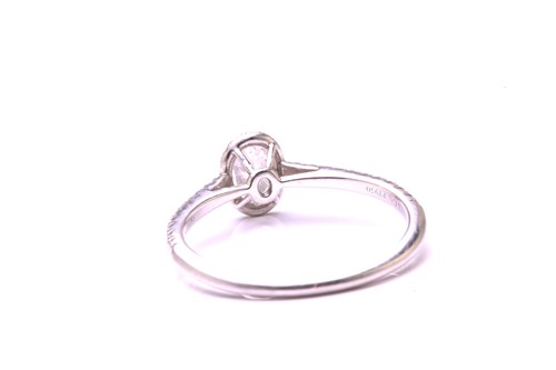 Lot 259 - A Tiffany & co. diamond set halo ring,...