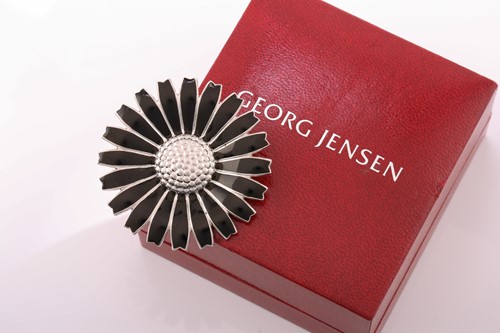 Lot 27 - Georg Jensen - A black enamelled daisy brooch...