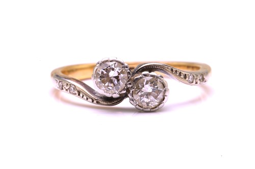 Lot 219 - A diamond Toi et Moi crossover ring, adorned...