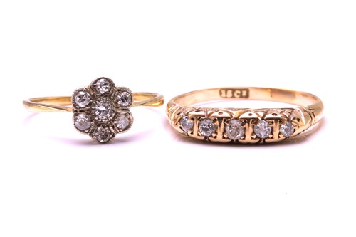 Lot 221 - Two diamond set rings, the first ring features...