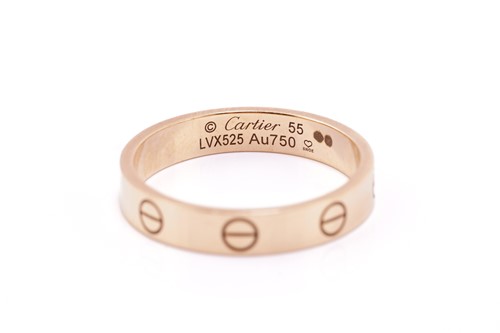 Lot 18 - Cartier 'Love' ring. The polished 18 carat...