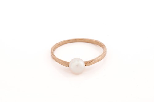Lot 279 - Four gem-set rings; a pearl ring with a flat...