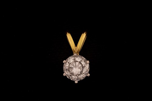 Lot 225 - A single diamond pendant, comprises a round...