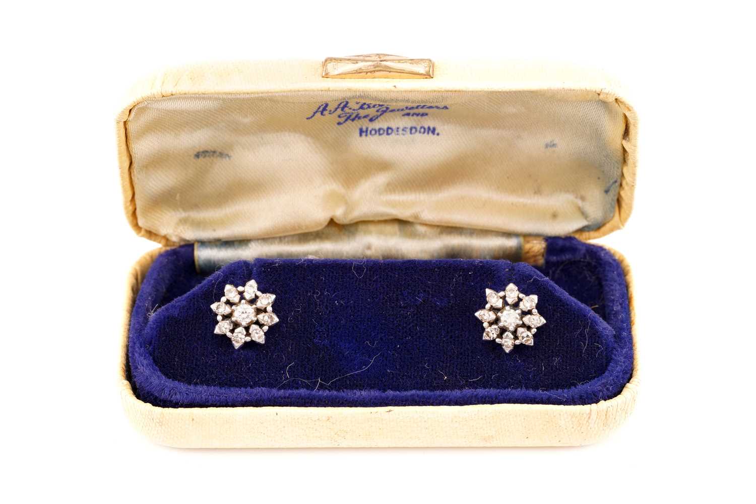 Lot 70 - A pair of diamond cluster earrings, each...