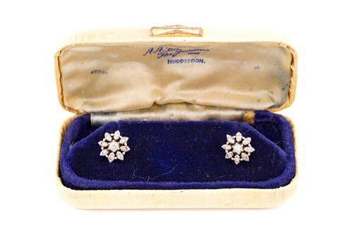 Lot 70 - A pair of diamond cluster earrings, each...