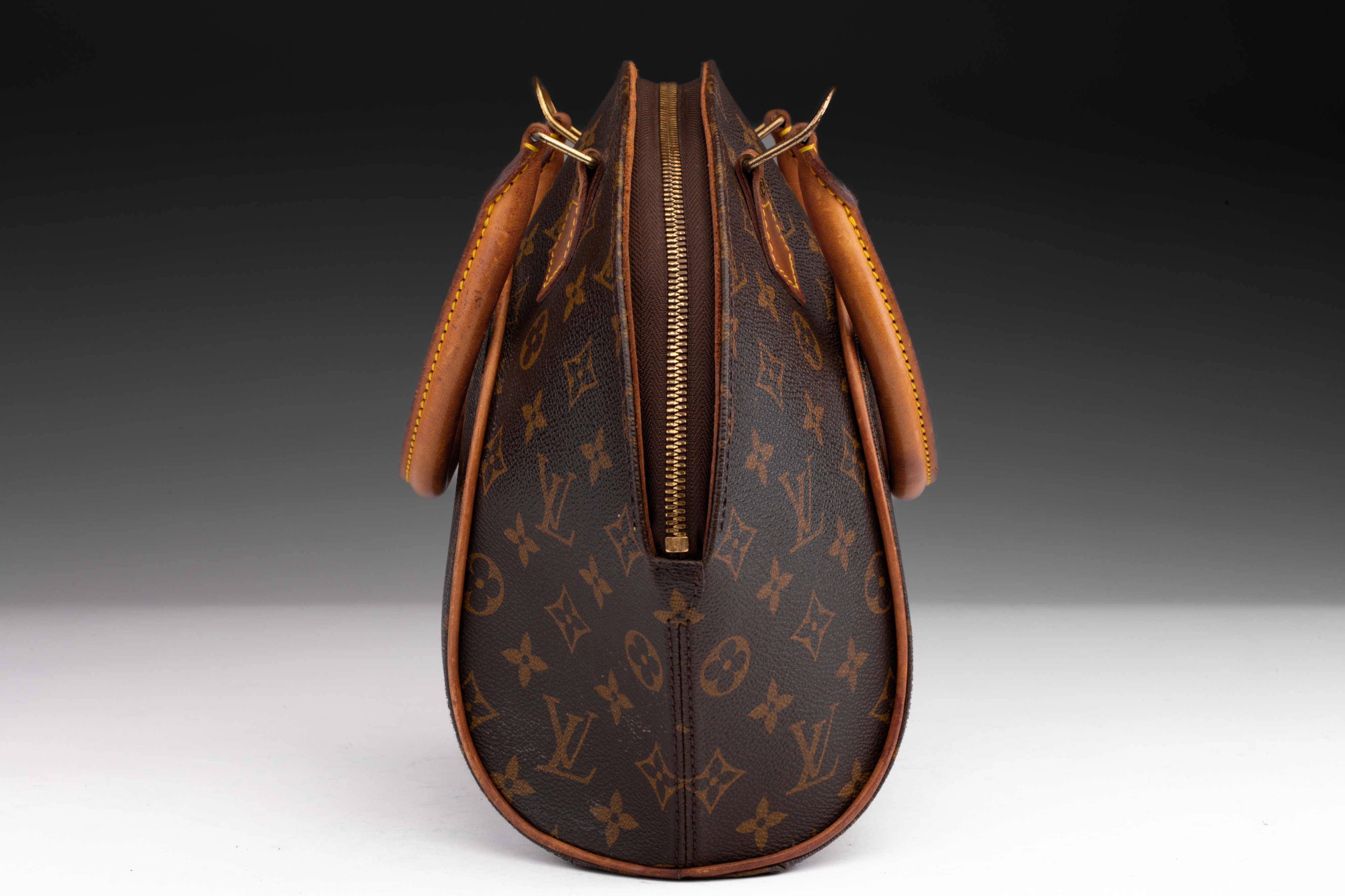 At Auction: Louis Vuitton, LOUIS VUITTON MONOGRAMMED ELLIPSE HANDBAG