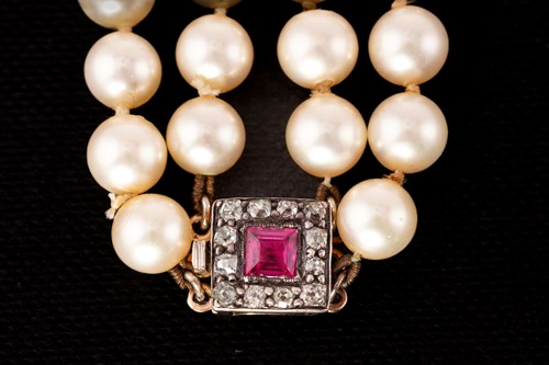 Lot 65 - Two cultured pearl necklaces with gem-set...