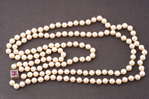 Lot 65 - Two cultured pearl necklaces with gem-set...