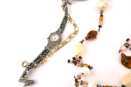 Lot 135 - A banded agate necklace, an Art Nouveau buckle...