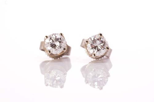 Lot 226 - A pair of diamond stud earrings, each...